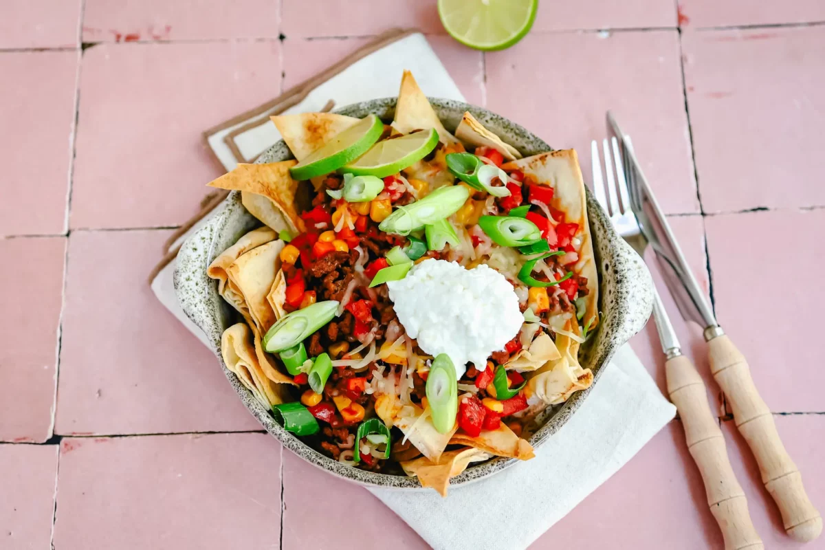 bowl of pita nachos with ground meat and cottage cheese